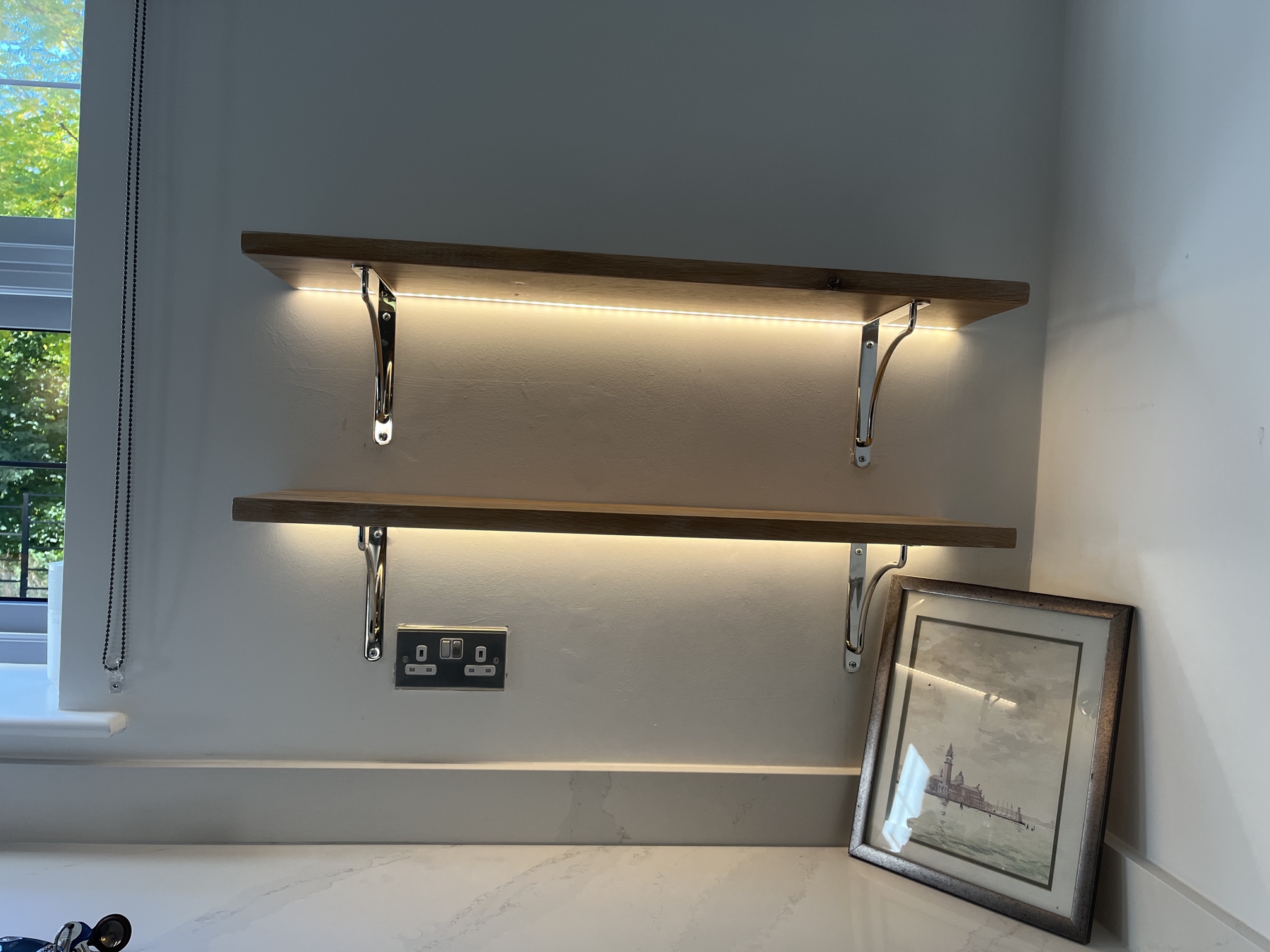 Recessed LED lights for shelves installed in Bath